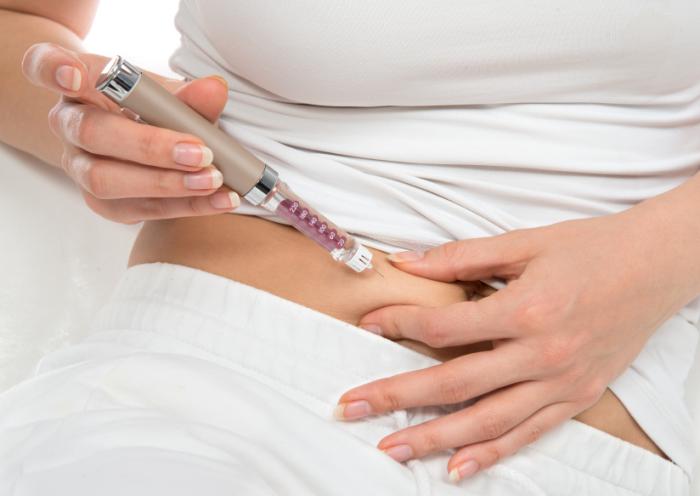 a-woman-administering-a-diabetes-injections